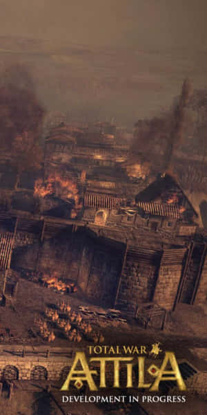 在《Total War Attila》遊戲場景中，一個燃燒的古老村莊，煙霧和火焰瀰漫。 — 插畫 壁紙