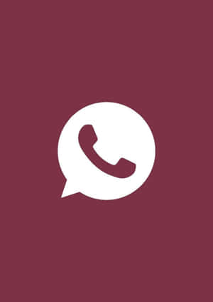 白色WhatsApp標誌在勃艮第色背景上