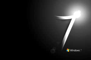 發光白色數字7，在深色背景上帶有光線，並附有Windows 7標誌。