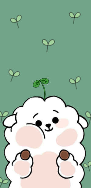 一隻可愛的卡通綿羊，頭上有嫩芽，在綠色背景上微笑。 — Kawaii 聖誕 GIF 壁紙