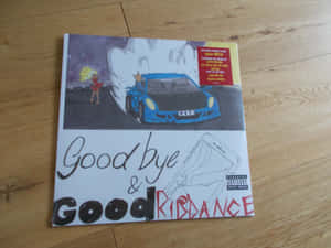 專輯封面，有藍色汽車、紅衣女孩和木地板上的電話圖案。