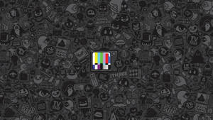 Wallpaper 以黑色背景上的電視測試圖案為中心，周圍環繞卡通貼紙。