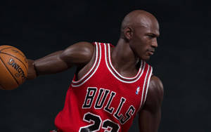米高佐敦公仔身穿紅色公牛隊球衣運球。 — Jordan 標誌 GIF 壁紙