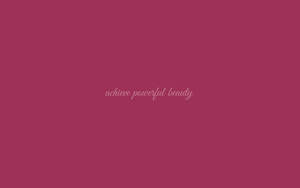 洋紅色背景，草書文字寫著 achieve powerful beauty