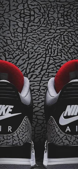 帶有大象印花圖案的黑紅 Nike Air Jordan 3 運動鞋。