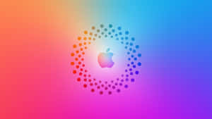 Apple 標誌被一圈點狀環繞，背景為色彩繽紛的漸變色。 — 彩色 壁紙
