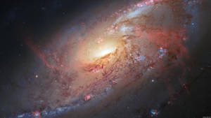 一個在深空中帶有發光旋臂和散落恆星的螺旋星系。