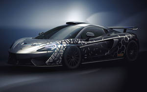 時尚的黑色和銀色McLaren跑車，在工作室燈光下具有幾何設計。 — 酷車 壁紙