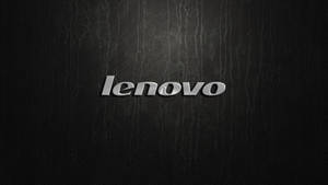 黑色皮革紋理上的閃亮銀色 Lenovo 標誌。