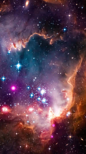 充滿活力的宇宙星雲，在深空中有閃亮的星星和色彩繽紛的氣體雲。 — 星星 壁紙