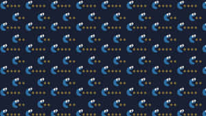 復古 Pac-Man 遊戲角色，在深藍色背景上有黃色圓點。 — 曲奇 壁紙