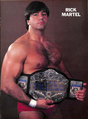 摔角手 Rick Martel 在工作室肖像中手持 AWA 世界重量級摔角冠軍腰帶。