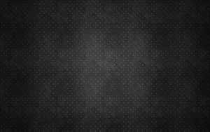 帶有漸變照明的暗色紋理菱形金屬板表面。 — 灰色 GIF 壁紙