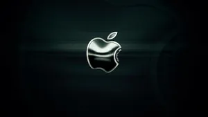 在深色背景上帶有碳纖維紋理的光亮 Apple 標誌