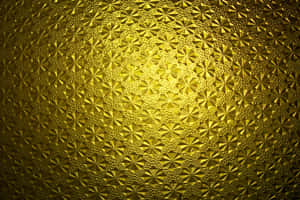 金色紋理表面，帶有星形圖案和溫暖的照明。 — 設計 壁紙