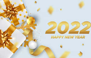 金色禮物和紙碎以節日文字慶祝2022年新年。