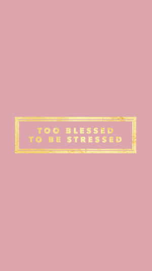 粉紅色背景，長方形內有金色文字寫著 too blessed to be stressed。