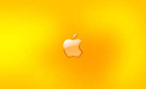光澤的Apple標誌在黃色漸變背景上。 — 金色 壁紙