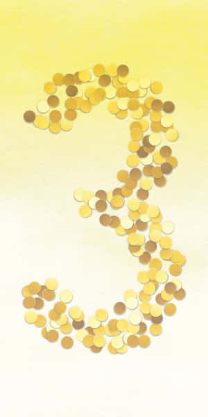 金幣在黃色背景上排列成數字三的形狀。