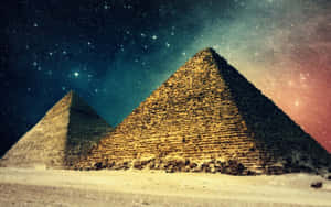 兩座金字塔在繁星點點的夜空下，帶有宇宙色彩。 — 天際線 壁紙