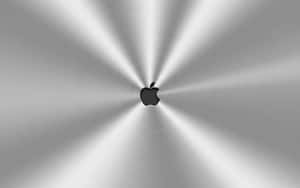 拉絲金屬上帶有輻射光線條紋的Apple標誌。