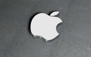 灰色混凝土地板上的白色Apple標誌