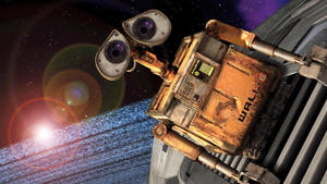 WALL-E 機械人喺外太空緊貼太空船，有發光行星同星星。