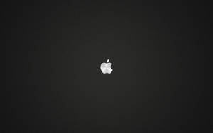 深色紋理背景上的銀色Apple標誌