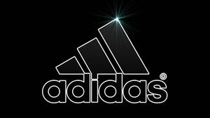 黑色背景上帶有發光星爆效果的Adidas標誌