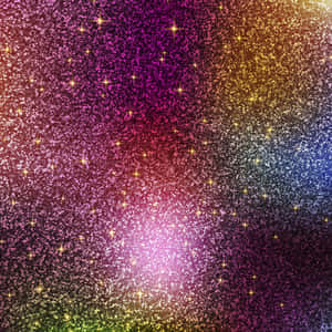 充滿活力的閃光漸變，星星在洋紅色、金色、藍色和綠色色調中閃爍。 — iPad 第9代 壁紙