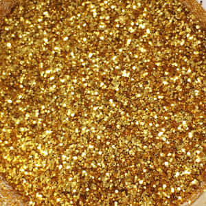 金色亮片顆粒在光線下閃爍的特寫。 — 金色美學 GIF 壁紙