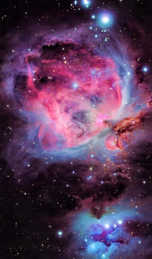 在深空中閃耀著星星的充滿活力的粉紅色、紫色和藍色星雲。 — 閃粉 壁紙