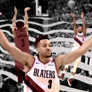 身穿 Blazers 球衣的籃球運動員在球迷背景下投籃。 — 西雅圖海怪 壁紙
