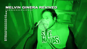 綠色夜視中的男子，帶有「Melvin Ginera Revived」文字。