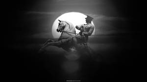 夜間士兵騎馬在滿月下的剪影。