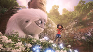 女孩在魔法森林中為巨型雪人演奏小提琴，周圍有發光的花朵和佛像。