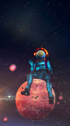 太空人坐在太空中的紅色行星上，有星星和漂浮的球體。 — Astroworld GIF 壁紙