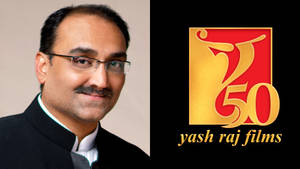 戴眼鏡和鬍子的男士肖像，旁邊是Yash Raj Films 50週年紀念標誌。
