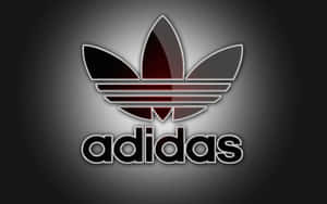深色漸變背景上帶有發光紅色和黑色三葉草的Adidas標誌