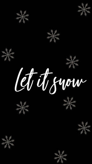 雪花和文字 let it snow 在黑色背景上