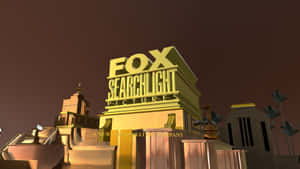 黃昏時風格化建築上的 Golden Fox Searchlight Pictures 標誌。