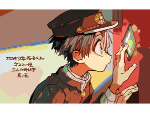 戴帽子的動漫男孩拿著相框，溫暖背景