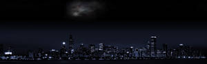 夜晚城市天際線，上方可見銀河