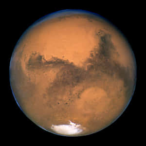 火星，表面呈鏽色，太空中帶有極地冰蓋。