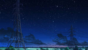 星空夜空下的電塔與發光的綠色田野。