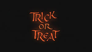 在黑色背景上，發光的橙色萬聖節文字寫著 Trick or Treat。 — 螢光黃 壁紙