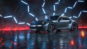 時尚灰色保時捷911 Turbo S在未來主義圓頂的霓虹燈下，映照在濕潤反射地板上。 — 酷車 壁紙
