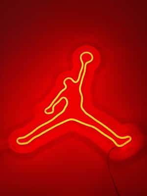 霓虹Jordan Jumpman標誌在紅色牆壁上發光。
