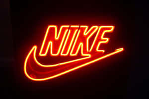 一個在黑暗中發光的亮紅色霓虹Nike標誌。