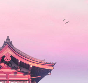 粉紅色寺廟屋頂，鳥兒在柔和的漸變天空中飛翔。 — 粉彩粉紅色 壁紙